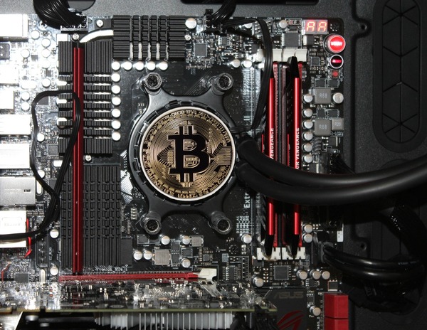 Bitcoin coin embedded in a computer motherboard